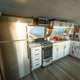 Image for article titled This Beautiful Coach Bus RV Has A Basement Bedroom And A Full Kitchen